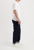 Sustainable MUD Jeans and denim jacket set, crafted from organic cotton, showcasing a classic blue wash and ethical design.